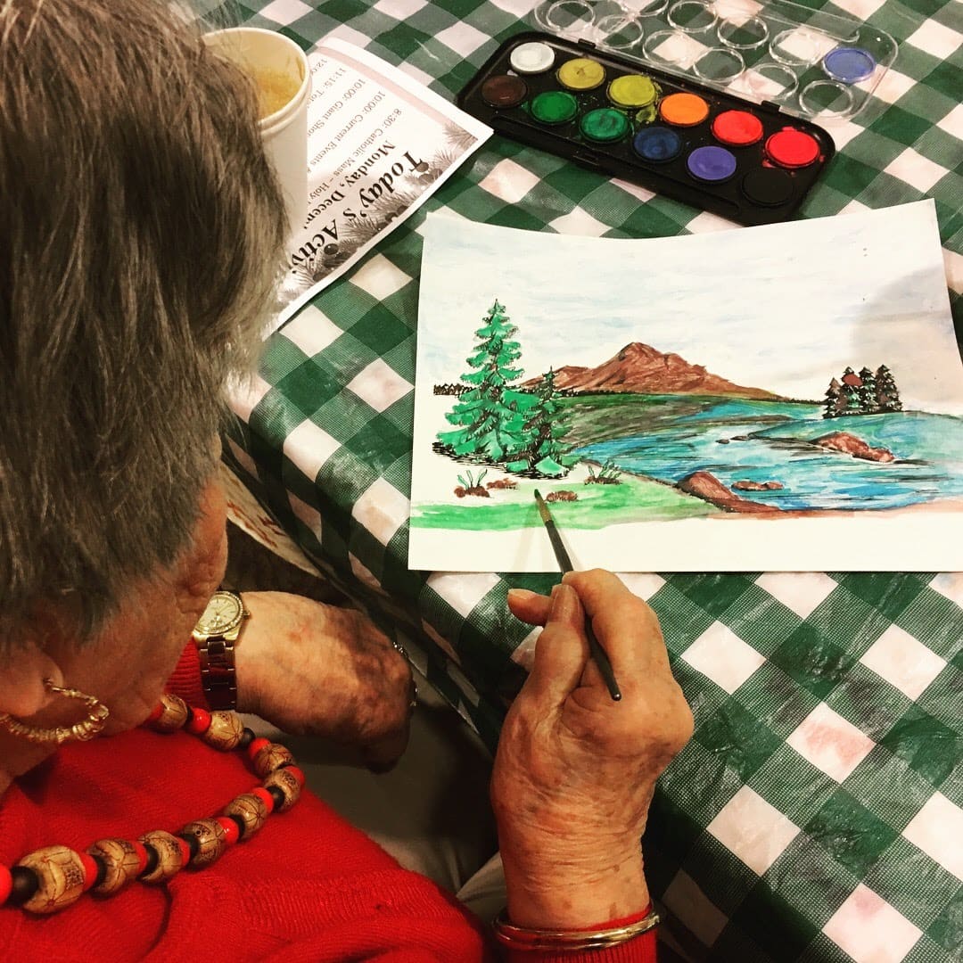 Kensington Park resident working on watercolor painting.
