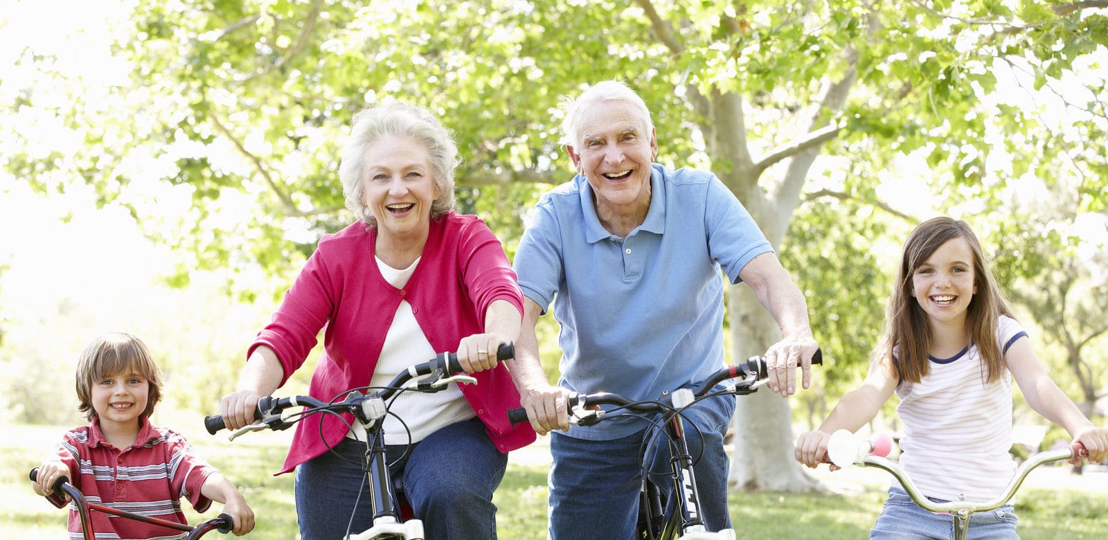 Senior couple with grandchildren on bikes