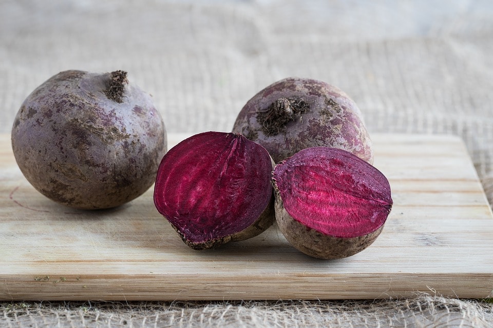 halved beets on cutting board