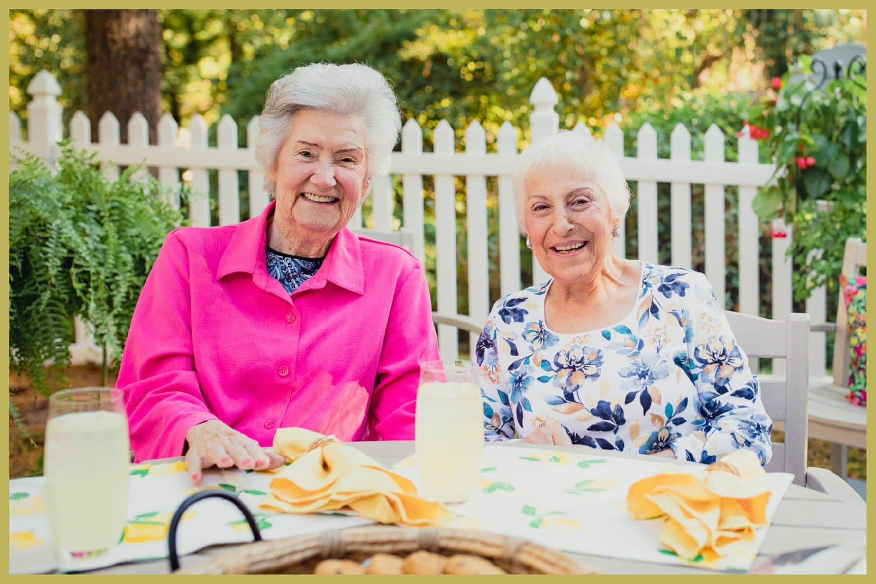 two senior women having breakfast outside