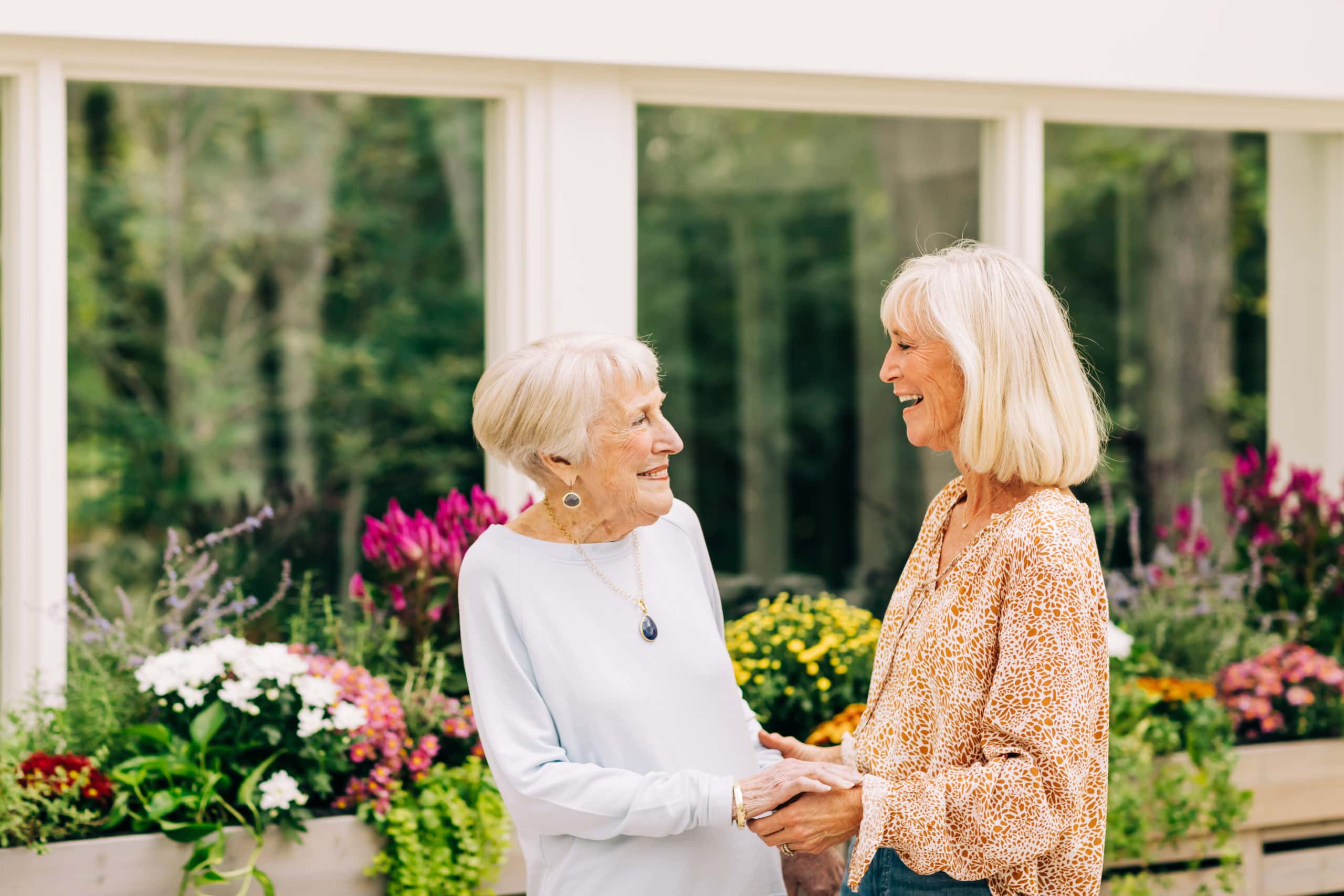 elderly woman and caregiver in garden