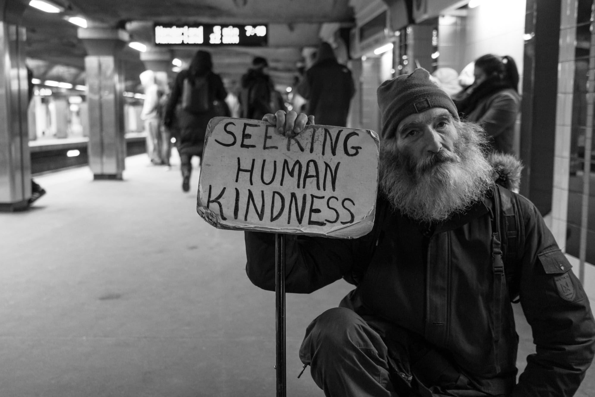 homeless man seeking human kindness