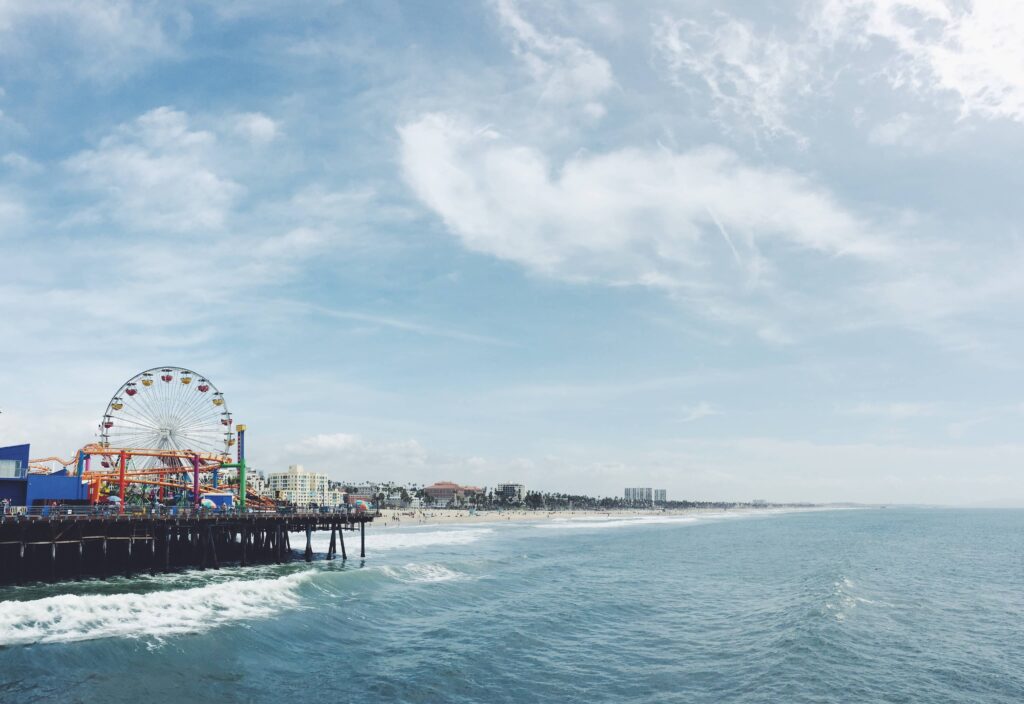 Pier and beach with sky.