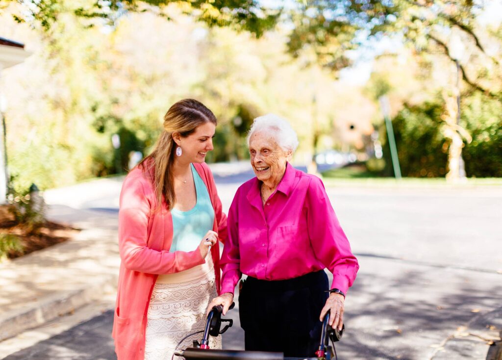 Leigh and Independent Living Resident enjoy a conversation outside at Kensington Park Senior Living in MD