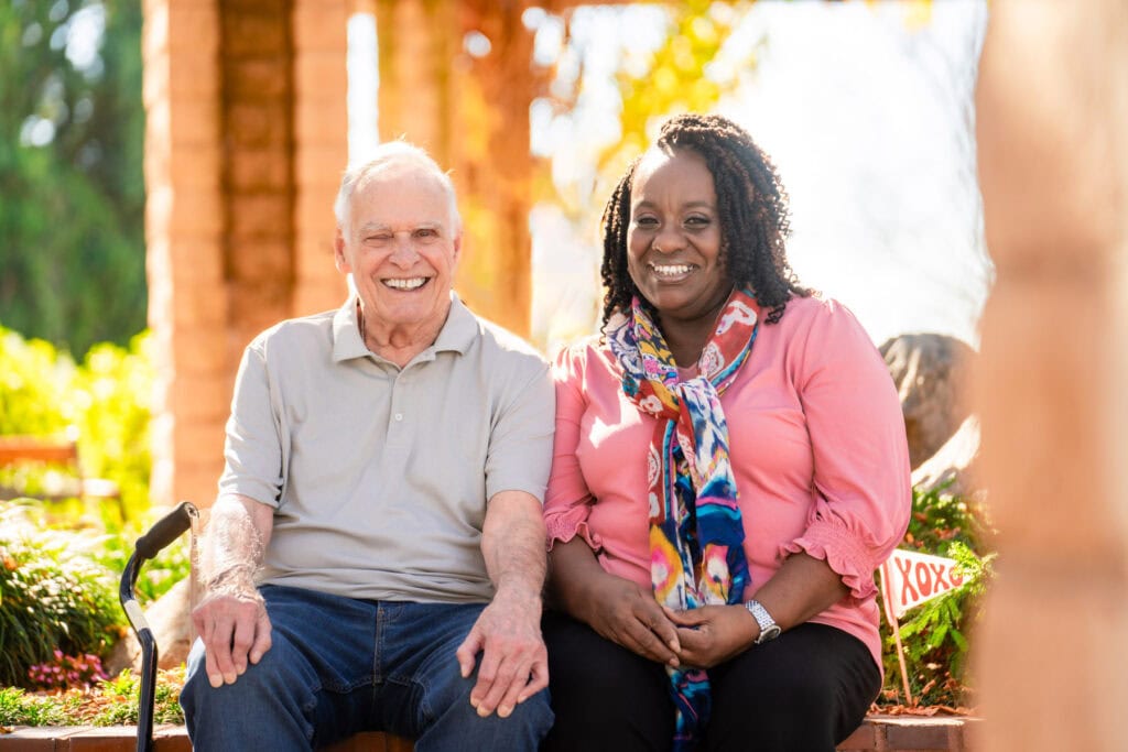 woman sitting next to older man