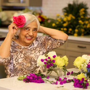 senior woman doing flower arrangements