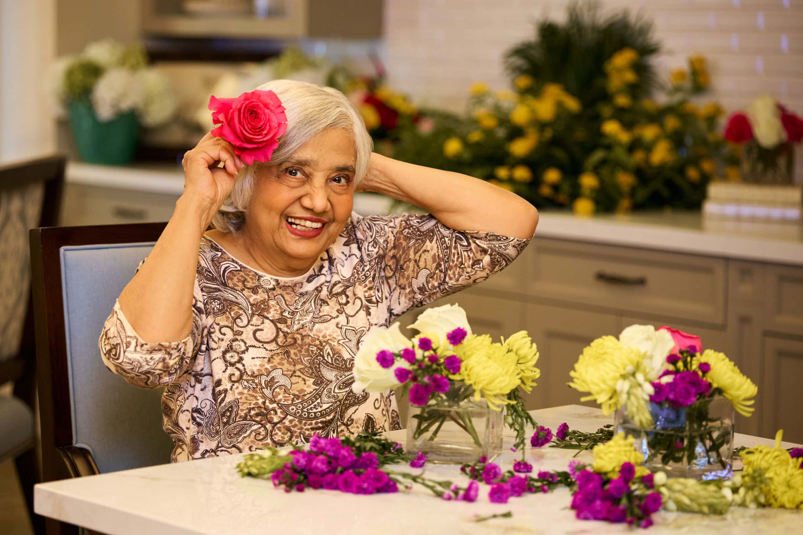 senior woman doing flower arrangements